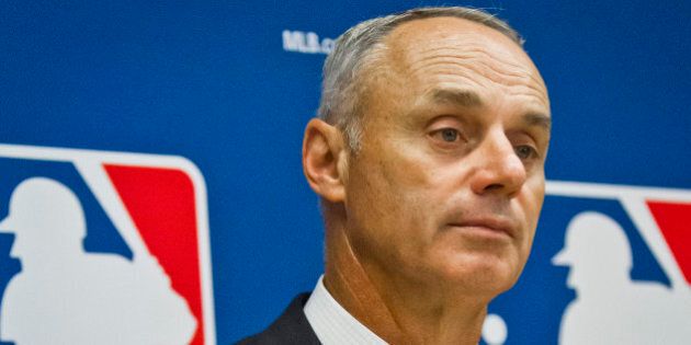 Baseball commissioner Rob Manfred listens during a press conference after his first owners' meeting as baseball commissioner, Thursday, May 21, 2015, in New York. (AP Photo/Bebeto Matthews)