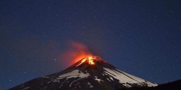 Picture of the Villarrica volcano, located near Villarrica 1200 km from Santiago, in southern Chile, which began erupting on March 3, 2015 forcing the evacuation of some 3,000 people in nearby villages. The Villarrica volcano, one of Chile's most active, began erupting around 3:00 am (0600 GMT), prompting authorities to declare a red alert and cancel classes in schools, the National Emergency Office said. AFP PHOTO /ARIEL MARINKOVIC (Photo credit should read ARIEL MARINKOVIC/AFP/Getty Images)