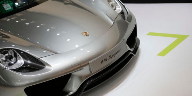 The 2015 Porsche 918 Spyder plug-in hybrid sports car is shown at the Los Angeles Auto Show on Thursday, Nov. 21, 2013, in Los Angeles. (AP Photo/Jae C. Hong)