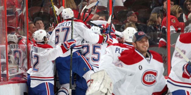 OTTAWA, ON - APRIL 19: Team mates Brian Flynn #32, Max Pacioretty #67 and Jacob De La Rose of the Montreal Canadiens celebrate their overtime win against the Ottawa Senators in Game Three of the Eastern Conference Quarterfinals during the 2015 NHL Stanley Cup Playoffs at Canadian Tire Centre on April 19, 2015 in Ottawa, Ontario, Canada. (Photo by Jana Chytilova/Freestyle Photography/Getty Images)