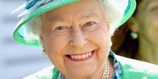 GLASGOW, SCOTLAND - JULY 24: Queen Elizabeth II smiles as she visits the Glasgow National Hockey Centre to watch the hockey during day one of 20th Commonwealth Games on July 24, 2014 in Glasgow, Scotland. (Photo by Chris Jackson - WPA Pool/Getty Images)