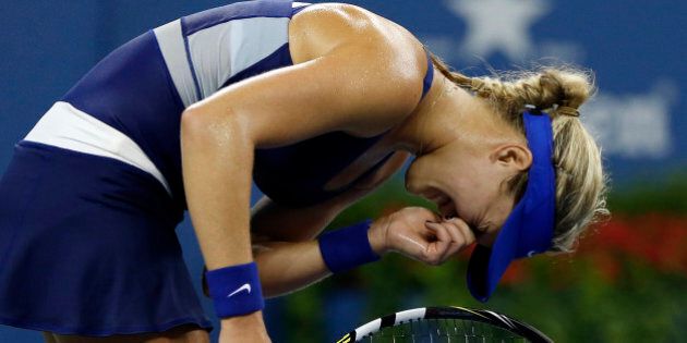 Eugenie Bouchard, of Canada, reacts after losing a point against Barbora Zahlavova Strycova, of the Czech Republic, during the third round of the U.S. Open tennis tournament Saturday, Aug. 30, 2014, in New York. (AP Photo/Elise Amendola)