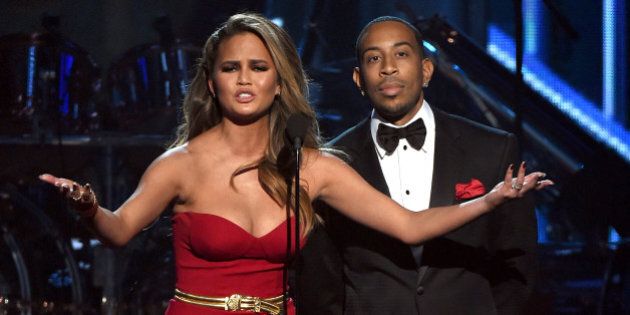 LAS VEGAS, NV - MAY 17: Hosts Chrissy Teigen (L) and Ludacris speak onstage during the 2015 Billboard Music Awards at MGM Grand Garden Arena on May 17, 2015 in Las Vegas, Nevada. (Photo by Ethan Miller/Getty Images)