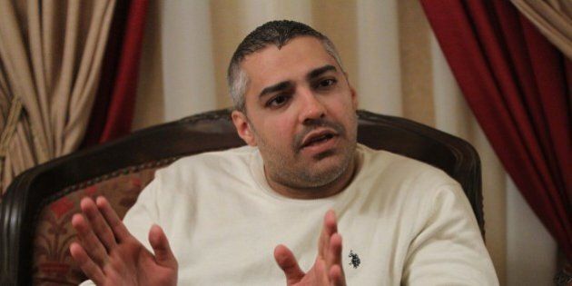 Al-Jazeera journalist Mohamed Fahmy gives an interview in Cairo on February 14, 2015 after he and his colleague Egyptian producer Baher Mohamed were released from an Egyptian jail on February 12. The ruling came after an appeals court overturned a previous jail sentence of up to 10 years handed down by a lower court that convicted them and their Australian colleague Peter Greste of aiding the banned Muslim Brotherhood. AFP PHOTO / HASAN MOHAMED (Photo credit should read HASAN MOHAMED/AFP/Getty Images)