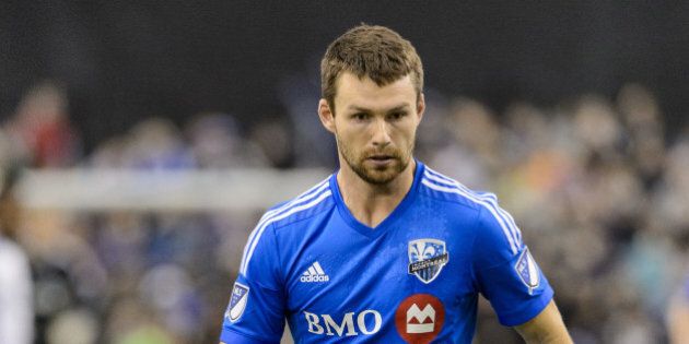 MONTREAL, QC - MARCH 28: Jack McInerney #99 of the Montreal Impact looks to play the ball during the MLS game against the Orlando City SC at the Olympic Stadium on March 28, 2015 in Montreal, Quebec, Canada. The game between Orlando City SC and the Montreal Impact ended in a 2-2 draw. (Photo by Minas Panagiotakis/Getty Images)