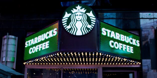 A Starbucks Coffee shop is shown, Thursday, March 19, 2015 in New York's Times Square. (AP Photo/Mark Lennihan)