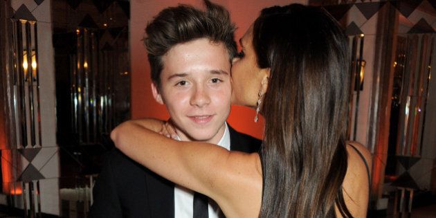 LONDON, ENGLAND - NOVEMBER 05: Brooklyn Beckham (L) and Victoria Beckham attend the Harper's Bazaar Women of the Year awards at Claridge's Hotel on November 5, 2013 in London, England. (Photo by David M. Benett/Getty Images)