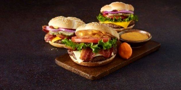 This undated handout photo provided by Mcdonald's shows Quarter Pounder with Cheese sandwiches, featuring thick cut bacon. McDonald's is adding three new Quarter Pounders to its menu as the fast-food chain looks to offer cheaper premium burgers while capitalizing on one of its most popular brands. (AP Photo/McDonald's, Claire Quinn)