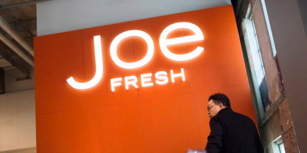 A shopper rides an escalator to the Joe Fresh outlet located in the former Maple Leaf Gardens in Toronto on Thursday, May 1, 2014. THE CANADIAN PRESS/Darren Calabrese