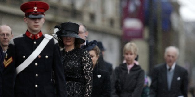 Members of the congregation file into Leicester Cathedral in central England, on March 26, 2015, ahead of a service of reinterment for England's King Richard III. England's slain king Richard III, exhumed from an undignified grave beneath a car park, will finally be buried with honour on Thursday in an unprecedented ceremony filled with pageantry and poignancy. AFP PHOTO / ADRIAN DENNIS/POOL (Photo credit should read ADRIAN DENNIS/AFP/Getty Images)