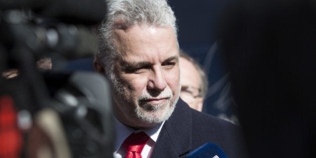 Quebec Liberal leader, Philippe Couillard, speaks to reporters in front of his campaign bus April 1, 2014 in Montreal, Canada. The elections are scheduled for April 7, 2014. AFP PHOTO/Francois Laplante Delagrave (Photo credit should read Francois Laplante Delagrave/AFP/Getty Images)