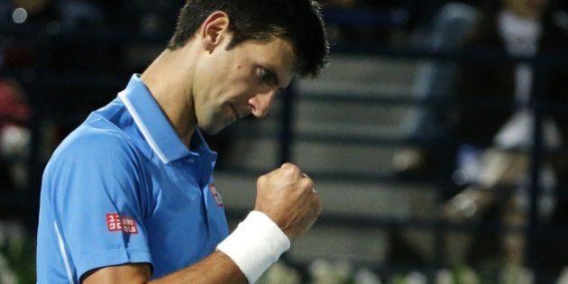 World number one Novak Djokovic of Serbia reacts after winning a point against Tomas Berdych of Czech Republic during their semi final match on the fifth day of the ATP Dubai Duty Free Tennis Championships on February 27, 2015 in Dubai. AFP PHOTO / KARIM SAHIB (Photo credit should read KARIM SAHIB/AFP/Getty Images)