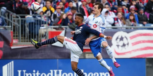 FOXBORO, MA - MARCH 21: Darrius Barnes #25 of New England Revolution wins a loose ball ahead of Cameron Porter #39 of Montreal Impact during the first half at Gillette Stadium on March 21, 2015 in Foxboro, Massachusetts. (Photo by Maddie Meyer/Getty Images)