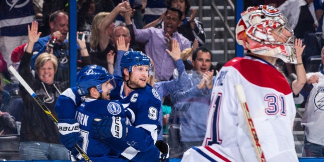 TAMPA, FL - MARCH 16: Steven Stamkos #91 of the Tampa Bay Lightning celebrates his goal with teammate Alex Killorn #17 during the first period against goalie Carey Price #31 of the Montreal Canadiens at the Amalie Arena on March 16, 2015 in Tampa, Florida. (Photo by Scott Audette/NHLI via Getty Images)