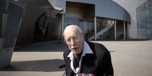 TO GO WITH AFP STORY BY ANNE MEYER 101 years old canadian veteran Ernest Cote poses in front of the Juno Beach museum in Juno Beach on April 17, 2014 in Courseulles-sur-Mer, western France. Ernest Cote landed on June 6, 1944 at 11am at Juno Beach. AFP PHOTO / CHARLY TRIBALLEAU (Photo credit should read CHARLY TRIBALLEAU/AFP/Getty Images)