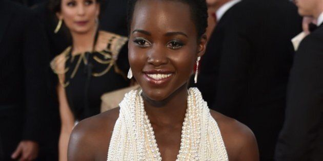 Actress Lupita Nyong'o poses on the red carpet for the 87th Oscars on February 22, 2015 in Hollywood, California. Local media are reporting that the Los Angles Sheriff's office is invetigating the February 26, 2015, theft of Nyong's's Oscar dress worth an estimated 150,000 USD. Sheriff's office officials say the dress with 6,000 pearls was reported stolen from the London West Hollywood Hotel. AFP PHOTO / MLADEN ANTONOV (Photo credit should read MLADEN ANTONOV/AFP/Getty Images)