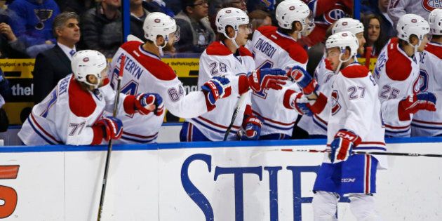 Montreal Canadiens' Alex Galchenyuk, right, is congratulated by teammates after scoring a goal during the second period of an NHL hockey game against the St. Louis Blues, Tuesday, Feb. 24, 2015, in St. Louis. (AP Photo/Billy Hurst)