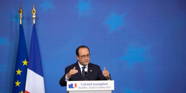 French President Francois Hollande speaks during a media conference at an EU summit in Brussels, on Friday, Oct. 24, 2014. EU leaders gathered Thursday for a two-day summit to discuss Ebola, climate change and the economy. (AP Photo/Virginia Mayo)