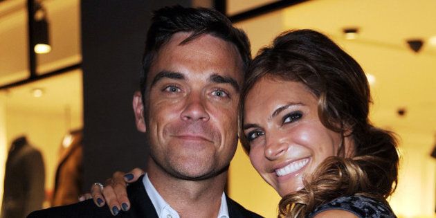 LONDON, ENGLAND - SEPTEMBER 16: Robbie Williams and wife, Ayda Field, attend the launch of the Spencer Hart flagship store on September 16, 2011 in London, England. Robbie is an investor and this is his second fashion launch this week.(Photo by Eamonn McCormack/WireImage)