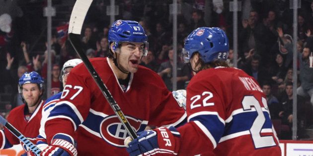 MONTREAL, QC - OCTOBER 25: Max Pacioretty #67 of the Montreal Canadiens celebrates with Dale Weise #22 after scoring a goal against of the New York Rangers in the NHL game at the Bell Centre on October 25, 2014 in Montreal, Quebec, Canada. (Photo by Francois Lacasse/NHLI via Getty Images)