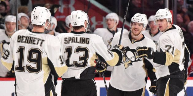 MONTREAL, QC - JANUARY 10: Evgeni Malkin #71 of the Pittsburgh Penguins celebrates with teammates after scoring a goal against the Montreal Canadiens in the NHL game at the Bell Centre on January 10, 2015 in Montreal, Quebec, Canada. (Photo by Francois Lacasse/NHLI via Getty Images)