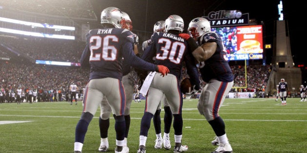 FOXBORO, MA - JANUARY 10: Duron Harmon #30 of the New England Patriots reacts after intercepting a pass late in the game during the 2015 AFC Divisional Playoffs game against the Baltimore Ravens at Gillette Stadium on January 10, 2015 in Foxboro, Massachusetts. (Photo by Jim Rogash/Getty Images)