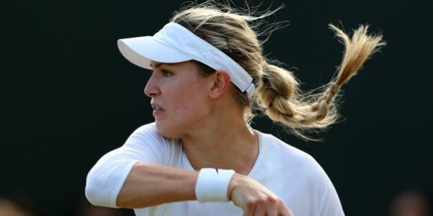 Canada's Eugenie Bouchard returns to Germany's Andrea Petkovic during their women's singles third round match on day six of the 2014 Wimbledon Championships at The All England Tennis Club in Wimbledon, southwest London, on June 28, 2014. AFP PHOTO / ANDREW COWIE - RESTRICTED TO EDITORIAL USE (Photo credit should read ANDREW COWIE/AFP/Getty Images)