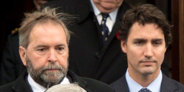 Prime Minister Stepehn Harper, front, NDP leader Thomas Mulcair,left, and Liberal leader Justin Trudeau, right, leave the church after funeral services for warrant officer Patrice Vincent Saturday, November 1, 2014 in Longueuil, Quebec. Vincent was run over and killed in what is being described as a terrorist attack last week. THE CANADIAN PRESS/Ryan Remiorz