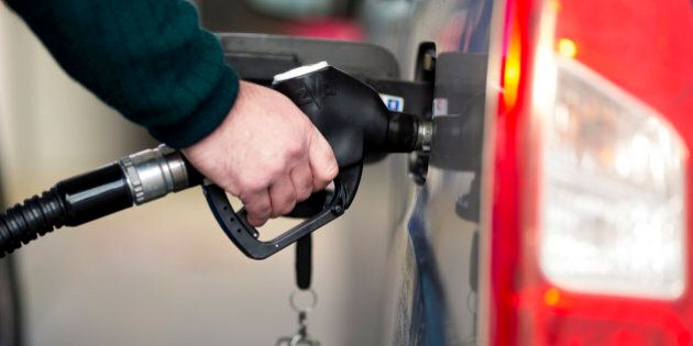 A driver holds a fuel pump as he refuels his automobile with diesel at a gas station in Guildford, U.K., on Monday, Dec. 8, 2014. Brent crude oil for January settlement climbed 67 cents to $66.86 a barrel on the London-based ICE Futures Europe exchange at 12:08 p.m. local time. after having slid $2.88 to $66.19 yesterday, the lowest close since September 2009. Photographer: Jason Alden/Bloomberg via Getty Images