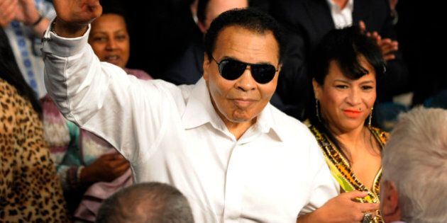 FILE - This May 1, 2010 file photo shows boxing legend Muhammad Ali waving seen before the Floyd Mayweather Jr. and Shane Mosley fight in Las Vegas. A sports charity says Ali will attend a London gala benefit in his honor two days before the Summer Olympics. (AP Photo/Mark J. Terrill, File)