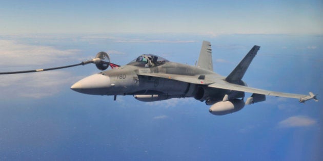 PACIFIC OCEAN (July 25, 2012) A Royal Canadian Air Force (RCAF) CF-18 Hornet from 425 Tactical Fighter Squadron in Bagotville, Quebec, gets refueled by a RCAF CC-130 Hercules air-to-air refueller from 435 Transport and Rescue Squadron, Winnipeg, Manitoba, over the Pacific Ocean near Joint Base Pearl Harbor-Hickam, in Honolulu, Hawaii, July 25 2012. Twenty-two nations, more than 40 ships and submarines, more than 200 aircraft and 25,000 personnel are participating in the biennial Rim of the Pacific (RIMPAC) exercise from June 29 to Aug. 3, in and around the Hawaiian Islands. The world's largest international maritime exercise, RIMPAC provides a unique training opportunity that helps participants foster and sustain the cooperative relationships that are critical to ensuring the safety of sea lanes and security on the world's oceans. RIMPAC 2012 is the 23rd exercise in the series that began in 1971. Canadian Forces photo by : MCpl Marc-Andre Gaudreault, Canadian Forces Combat Camera/RELEASED