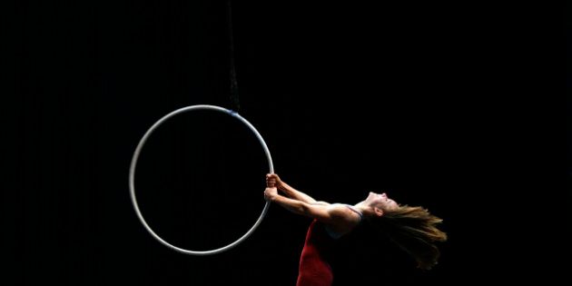 An artist of the Cirque du Soleil performs on the stage during a rehearsal for the media ahead of the show