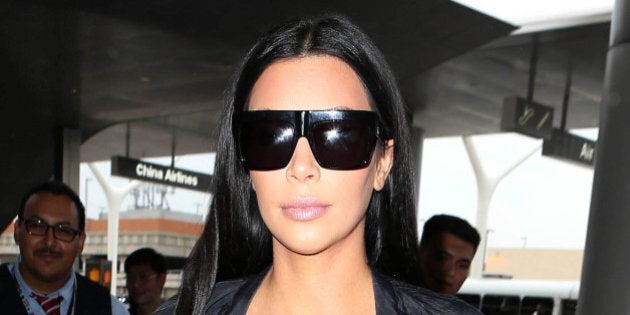 Photo by: KGC-173/STAR MAX/IPx 2015 7/19/15 Kim Kardashian is seen at Los Angeles International Airport (LAX). (Los Angeles, CA)