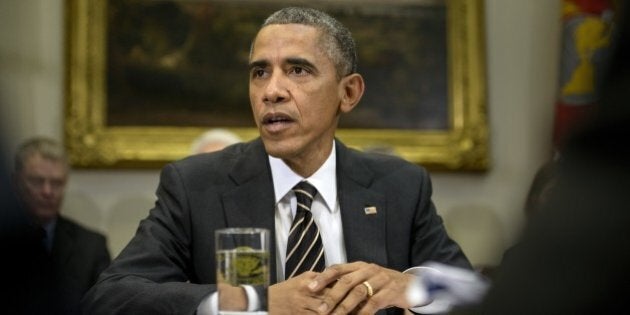 US President Barack Obama makes a statement to the press before a meeting in the Roosevelt Room of the White House December 12, 2014 in Washington, DC. Obama spoke before a meeting with his Ebola response team. AFP PHOTO/BRENDAN SMIALOWSKI (Photo credit should read BRENDAN SMIALOWSKI/AFP/Getty Images)