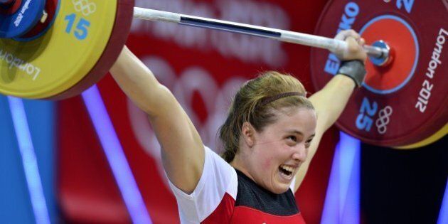 Canada's Marie-Eve Beauchemin-Nadeau competes during the women's 69kg group B weightlifting event, at the Excel Centre in London on August 1, 2012 during the London 2012 Olympic Games. AFP PHOTO / YURI CORTEZ (Photo credit should read YURI CORTEZ/AFP/GettyImages)
