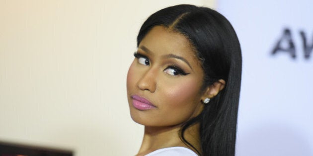 Nicki Minaj, winner of the awards for Coca-Cola viewers choice and best female hip hop artist, poses in the pressroom at the BET Awards at the Microsoft Theater on Sunday, June 28, 2015, in Los Angeles. (Photo by Richard Shotwell/Invision/AP)