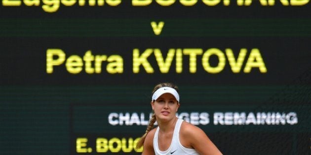 Canada's Eugenie Bouchard eyes the ball from Czech Republic's Petra Kvitova during their women's singles final match on day twelve of the 2014 Wimbledon Championships at The All England Tennis Club in Wimbledon, southwest London, on July 5, 2014. AFP PHOTO / CARL COURT - RESTRICTED TO EDITORIAL USE (Photo credit should read CARL COURT/AFP/Getty Images)