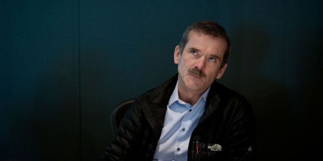Canadian astronaut Chris Hadfield pauses during an interview in Toronto, Ontario, Canada, on Wednesday, March 26, 2014. Hadfield, best known for performing David Bowie's 'Space Oddity' while in space, will be featured in a series of films promoting Ireland tourism. Photographer: Galit Rodan/Bloomberg via Getty Images. ***Local Caption*** Chris Hadfield
