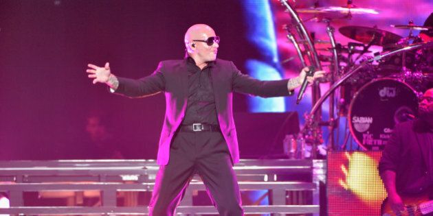 LOS ANGELES, CA - OCTOBER 10: Singer Pitbull performs at Staples Center on October 10, 2014 in Los Angeles, California. (Photo by Michael Tullberg/Getty Images)