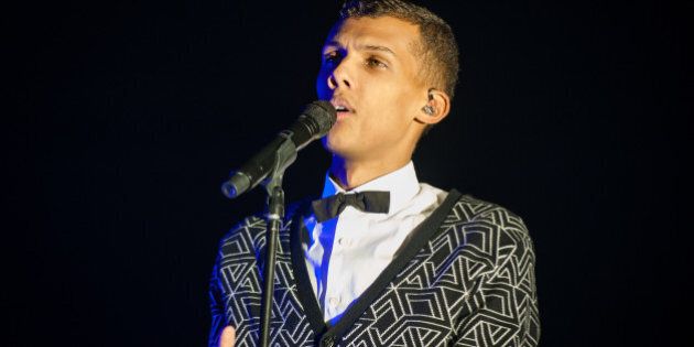 LONDON, ENGLAND - DECEMBER 09: Stromae performs on stage at Eventim Apollo, Hammersmith on December 9, 2014 in London, United Kingdom (Photo by Gaelle Beri/Redferns via Getty Images)