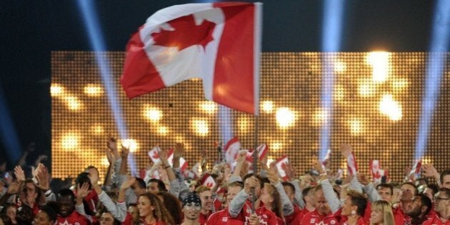 The delegation from Canada arrives during the opening ceremony for the 2015 Pan American Games at the Rogers Centre in Toronto, Ontario, on July 10, 2015. AFP PHOTO / HECTOR RETAMAL (Photo credit should read HECTOR RETAMAL/AFP/Getty Images)