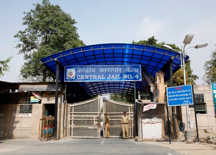 Police stand guard at one of the gates of the Tihar Jail, which is the biggest prison in South Asia, in New Delhi on March 11, 2013.