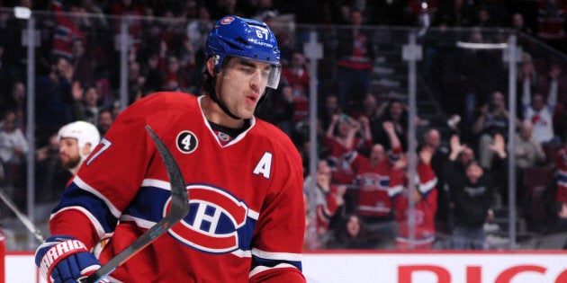 MONTREAL, QC - MARCH 28: Max Pacioretty #67 of the Montreal Canadiens celebrates after scoring the game winning goal in overtime during the NHL game against the Florida Panthers at the Bell Centre on March 28, 2015 in Montreal, Quebec, Canada. The Canadiens defeated the Panthers 3-2 in overtime. (Photo by Richard Wolowicz/Getty Images)