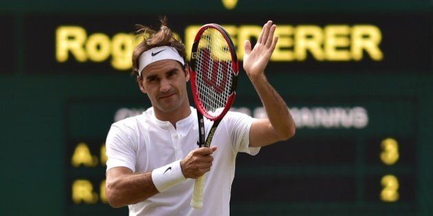 Switzerland's Roger Federer celebrates after beating Britain's Andy Murray during their men's semi-final match on day eleven of the 2015 Wimbledon Championships at The All England Tennis Club in Wimbledon, southwest London, on July 10, 2015. Federer won the match 7-5, 7-5, 6-4. RESTRICTED TO EDITORIAL USE -- AFP PHOTO / LEON NEAL (Photo credit should read LEON NEAL/AFP/Getty Images)