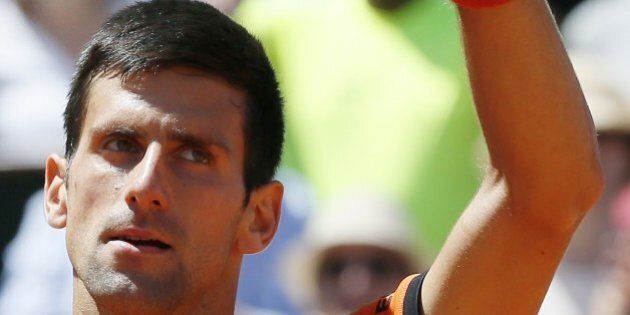 Serbia's Novak Djokovic celebrates his victory over Great Britain's Andy Murray during their men's semi-final match of the Roland Garros 2015 French Tennis Open in Paris on June 6, 2015. AFP PHOTO / PATRICK KOVARIK (Photo credit should read PATRICK KOVARIK/AFP/Getty Images)