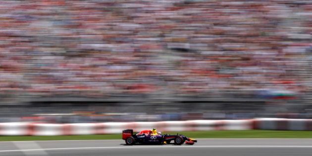 Red Bull driver Daniel Ricciardo, from Australia, drives through the course during the Canadian Grand Prix Sunday, June 8, 2014, in Montreal. Ricciardo won the race. (AP Photo/David J. Phillip)