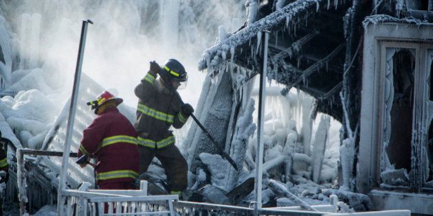 L'ISLE-VERTE, QC - JANUARY 24: The search continues as 30 people remain missing after a massive fire in L'Isle-Verte, a small community of approximately 1,500 people in Quebec. Crews are battling cold temperatures and hazardous conditions. Fire ripped through Residence du Havre, a seniors' residence, in the early morning hours of January 23. January 24, 2014. (Randy Risling/Toronto Star via Getty Images)