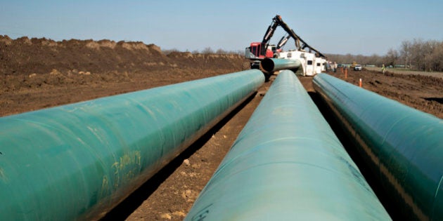 Three sections of pipe sit on the ground during construction of the Gulf Coast Project pipeline in Atoka, Oklahoma, U.S., on Monday, March 11, 2013. The Gulf Coast Project, a 485-mile crude oil pipeline being constructed by TransCanada Corp., is part of the Keystone XL Pipeline Project and will run from Cushing, Oklahoma to Nederland, Texas. Photographer: Daniel Acker/Bloomberg via Getty Images