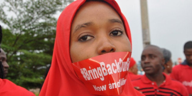 A woman attends a demonstration in Abuja, Nigeria, Thursday Sept. 11, 2014, calling on the government to rescue the kidnapped girls of the government secondary school in Chibok. More than 200 schoolgirls were kidnapped from a school in Chibok in Nigeria's north-eastern state of Borno on April 14. Boko Haram claimed responsibility for the act. (AP Photo/Olamikan Gbemiga)