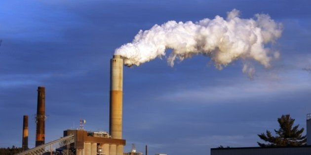 FILE - In this Tuesday, Jan. 20, 2015, file photo a plume of steam billows from the coal-fired Merrimack Station in Bow, N.H. After failing six years ago to craft a global agreement to fight climate change, world governments are hoping that this year will mark a breakthrough in the slow-paced U.N. climate talks. In Geneva this week, negotiators from more than 190 countries are working on an early draft of a deal that's supposed to be adopted in Paris in December.(AP Photo/Jim Cole, File)